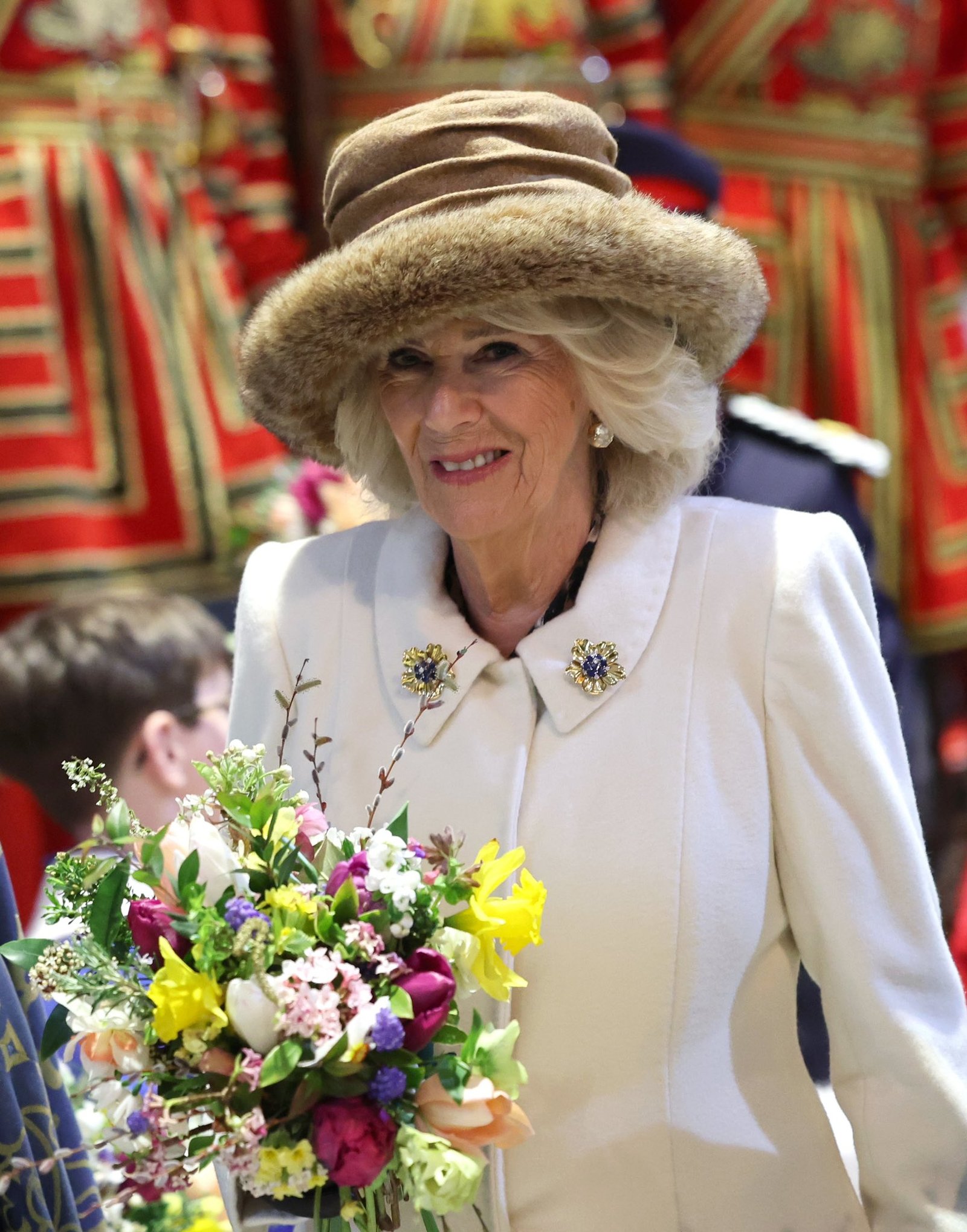 camilla wearing Elizabeth II's Cartier gold and sapphire flower brooches