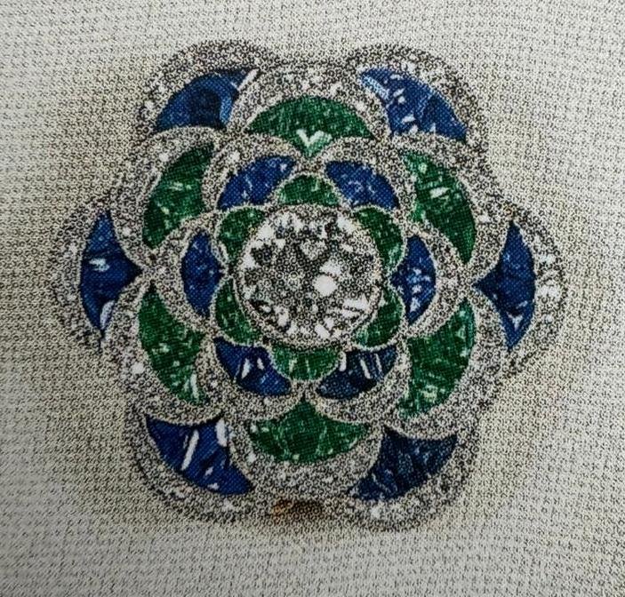 A closer look at Queen Mary's emerald and sapphire flower brooch.