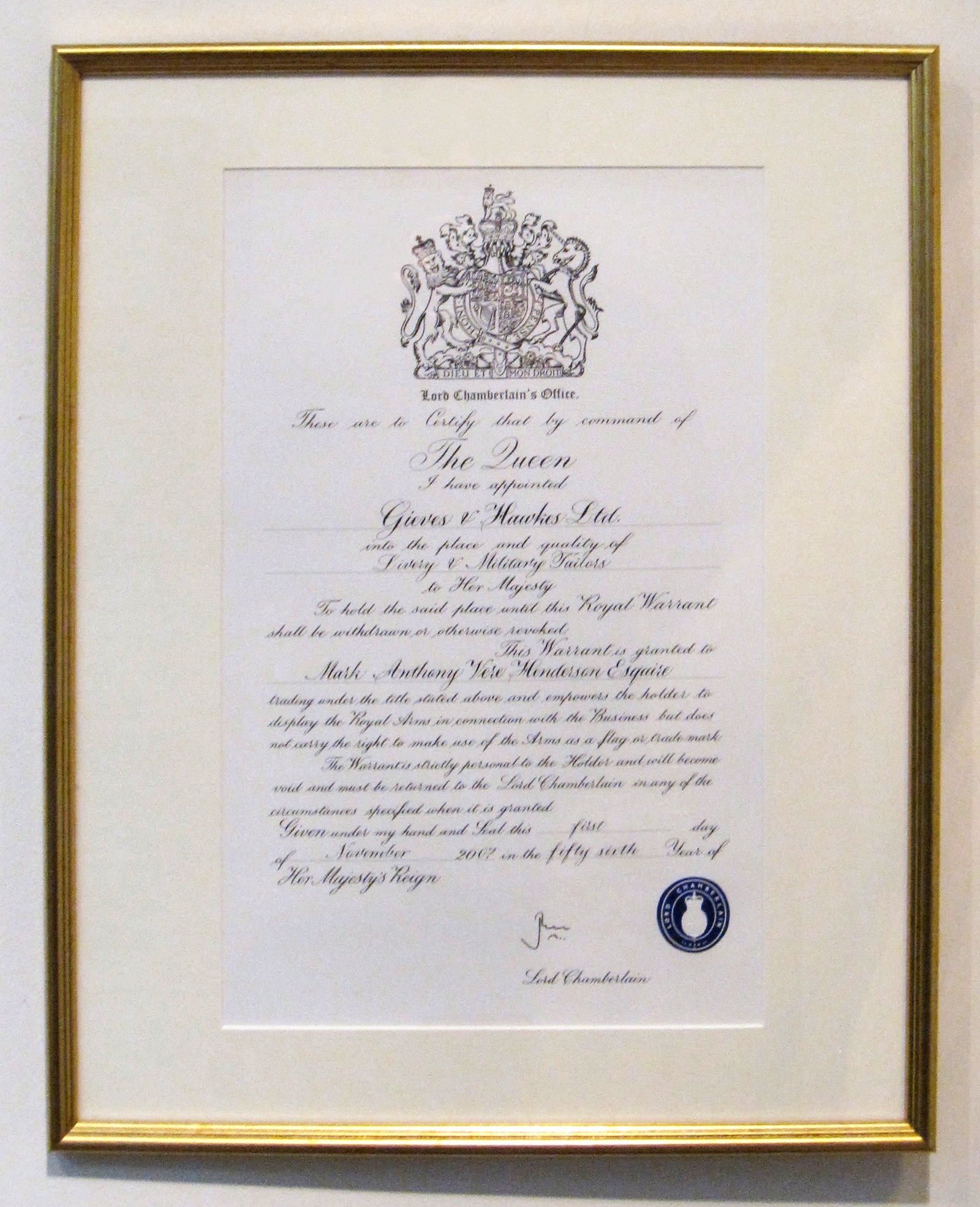 The official Royal Warrant Display Document from Elizabeth II on display at Savile Row tailor Gieves & Hawkes. (Wikipedia)