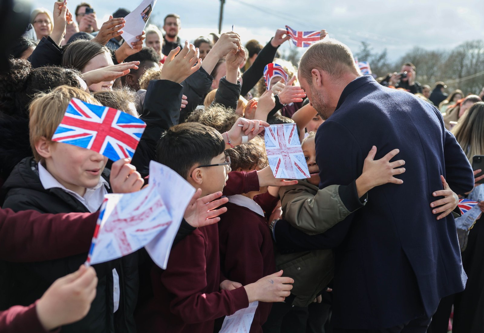 A round of hugs was on the cards for Prince William at the start of his visit. 