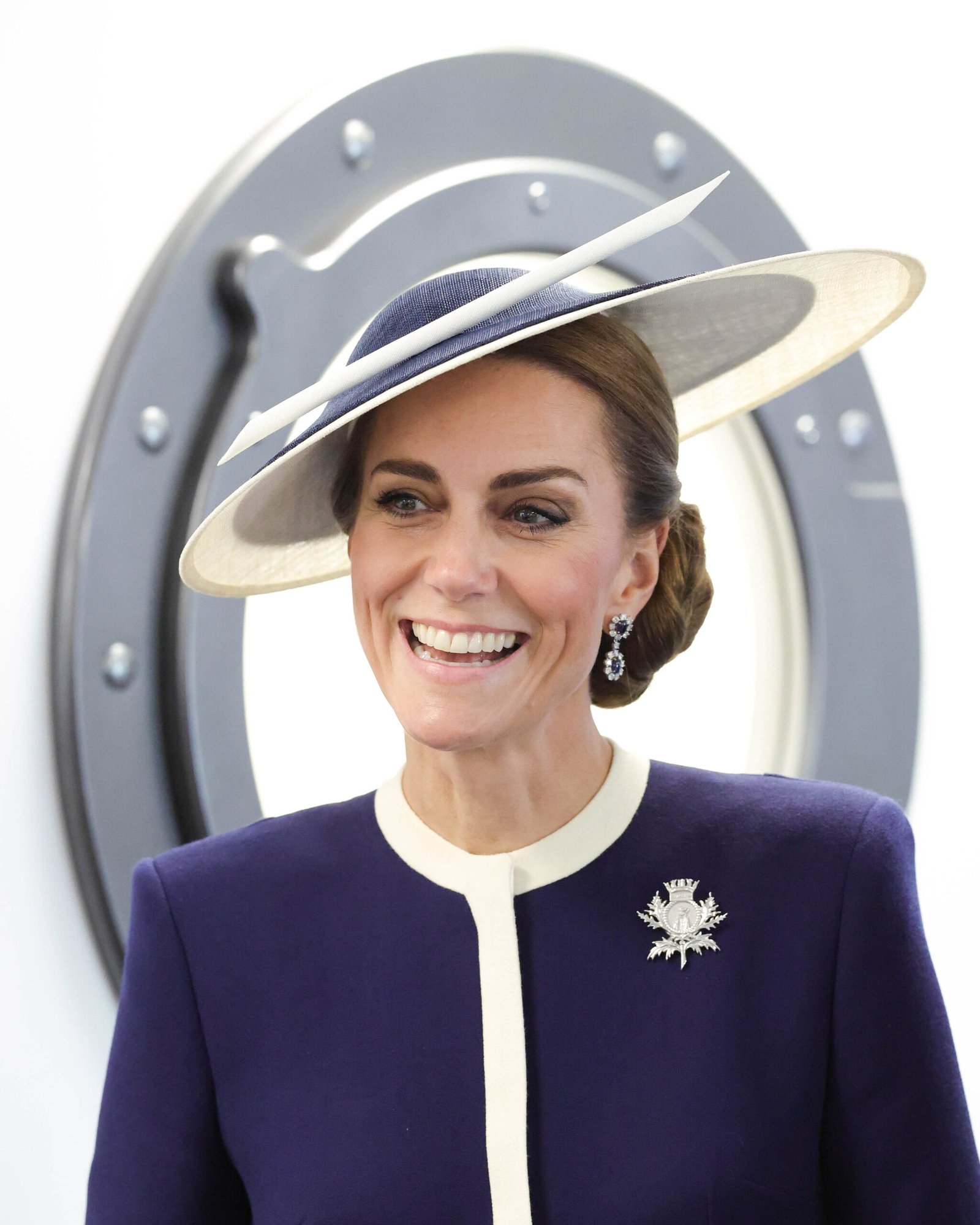 The Princess of Wales wearing her HMS Glasgow brooch.
