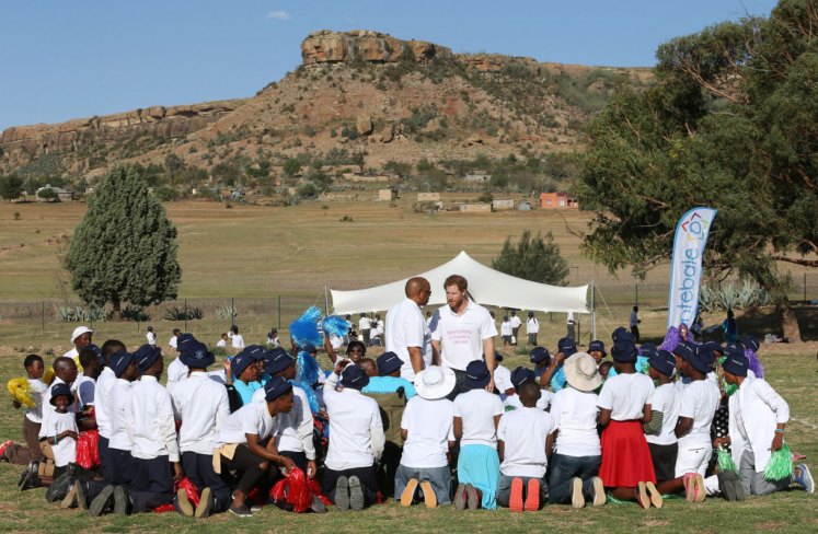 Image licensed to i-Images Picture Agency. 26/11/2015. Maseru, Lesotho. Prince Harry and Prince Seeiso of Lesotho surrounded by children at the opening of Mamohato Children's Centre in Lesotho, on the first day of his tour of Lesotho and South Africa. Picture by Stephen Lock / i-Images