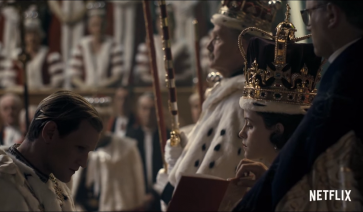Prince Philip kneels before The Queen at the coronation - but the scene is fraught with tension. (Netflix)