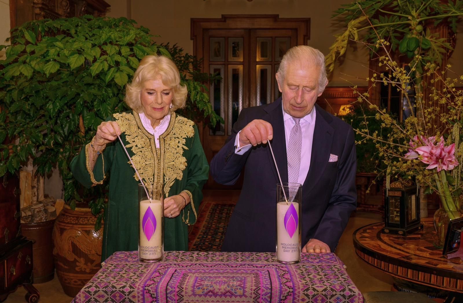 Their Majesties are pictured lighting a candle at Sandringham House to mark 2024's Holocaust Memorial Day.