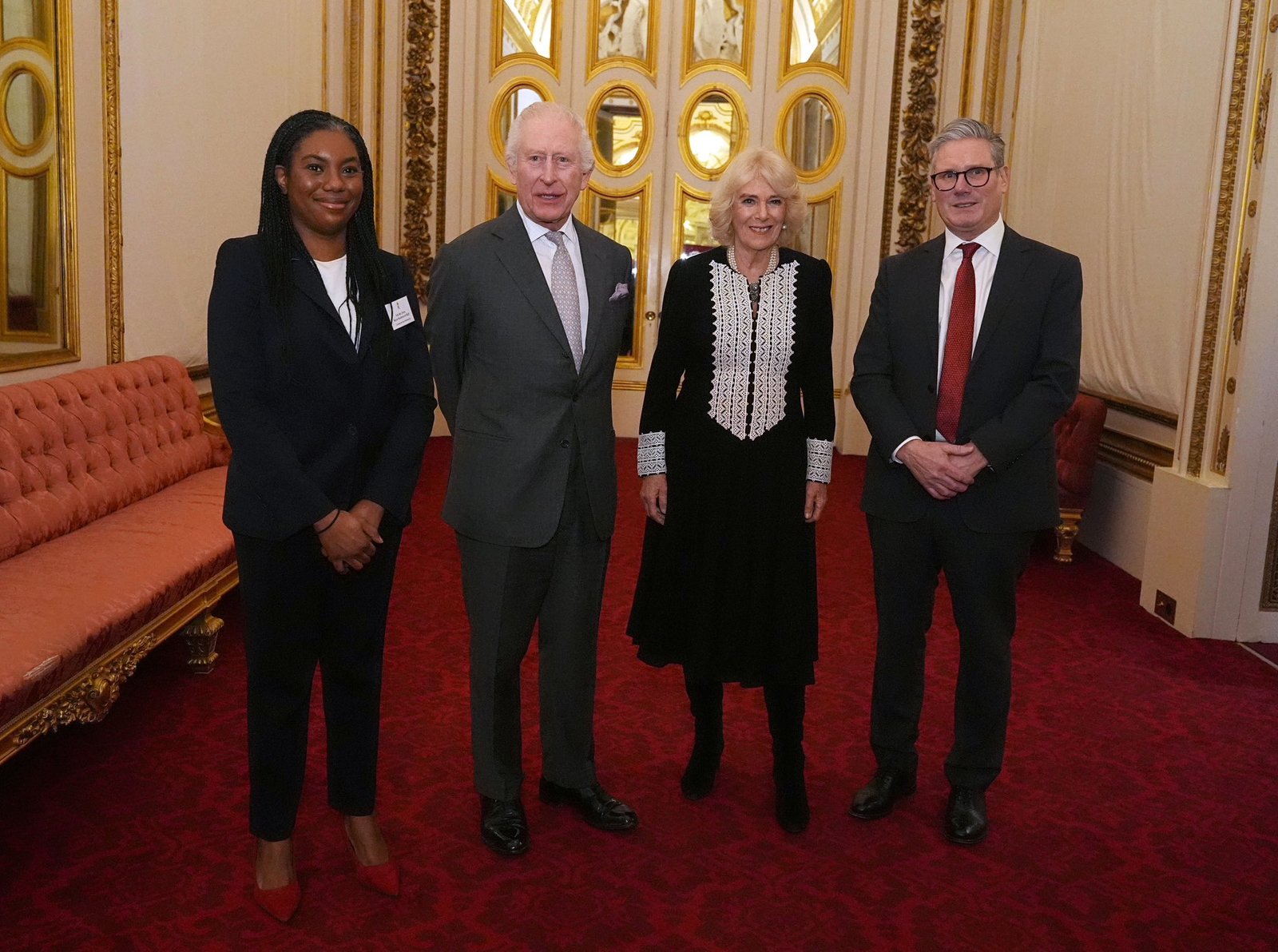 The King and Queen with the Prime Minister and the Leader of the Opposition. (Royal Family)