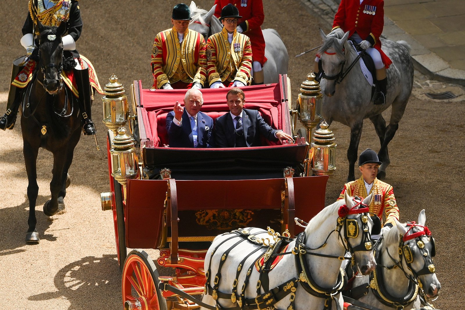 The King and President of France riding in a carriage procession. (Royal Family)