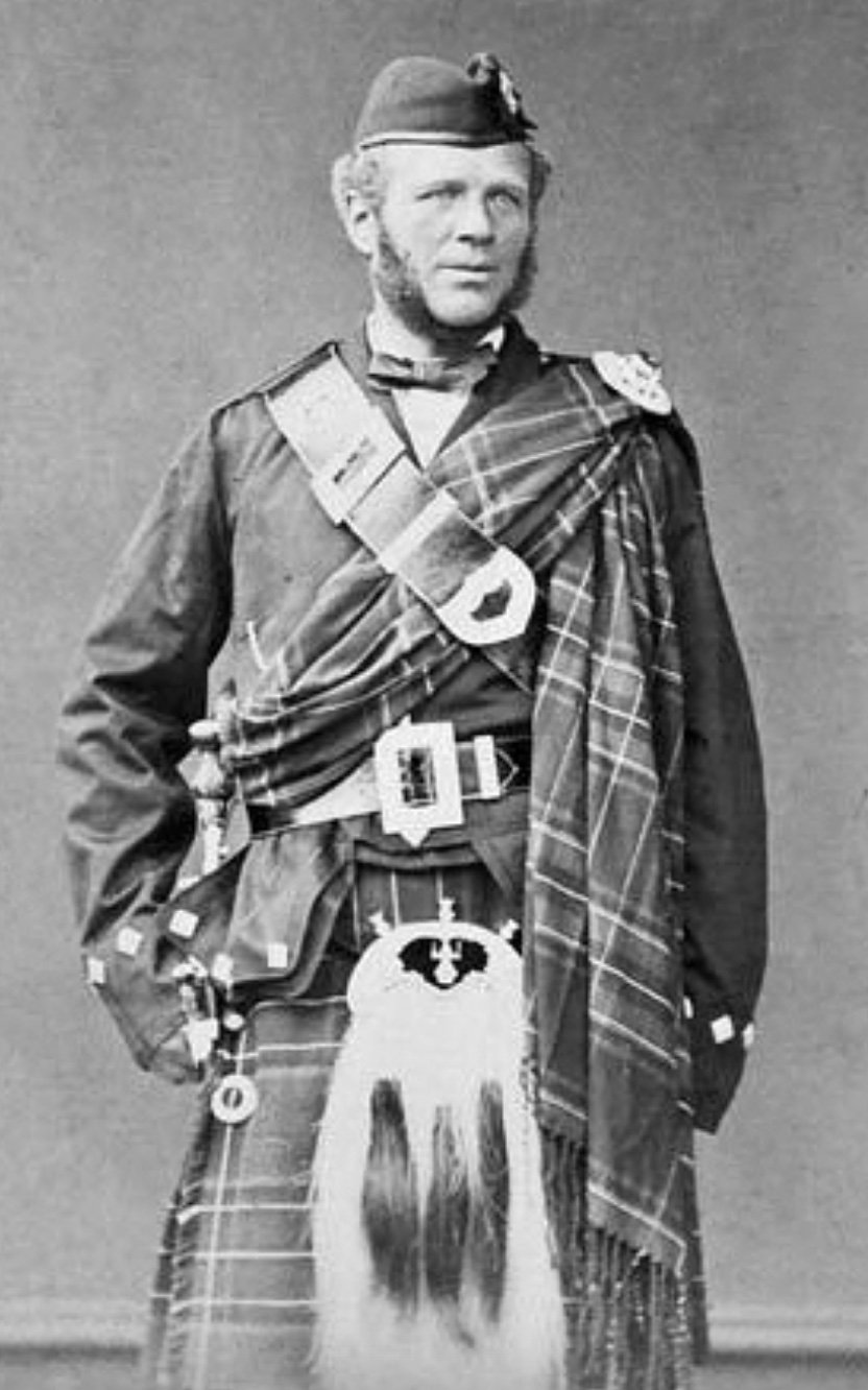 A black and white photograph of a man in traditional Scottish clothing and kilt. He has a beard. This is John Brown, Queen Victoria's servant and possible lover