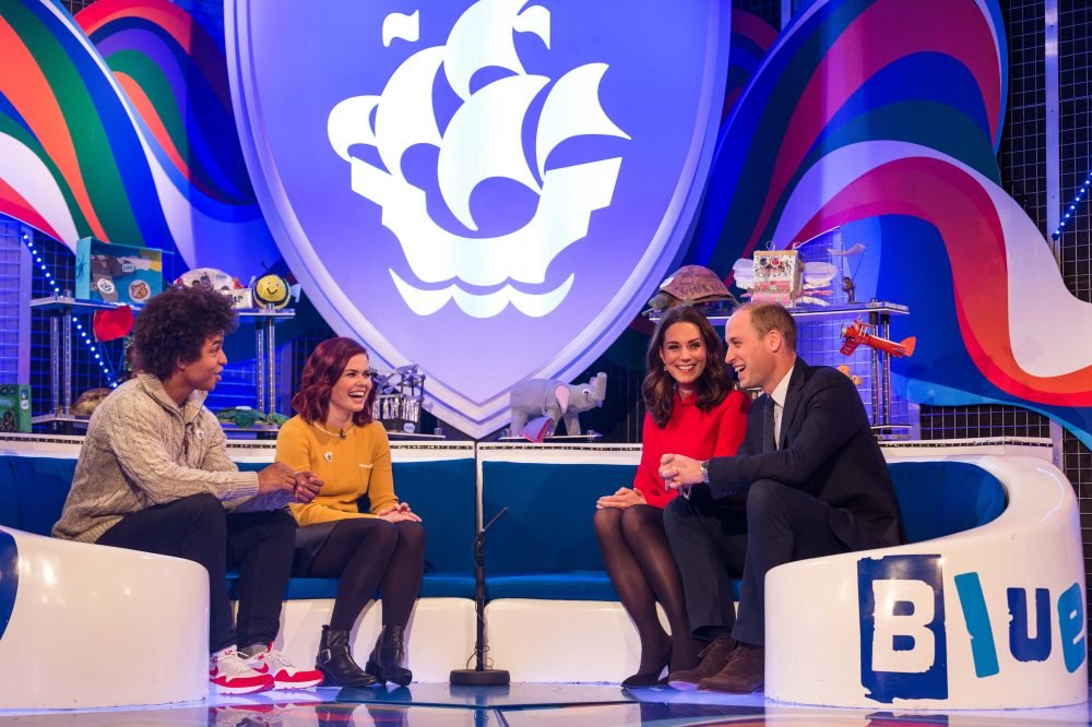 14958246-high_res-duke-and-duchess-of-cambridge-visit-blue-peter The Duke and Duchess of Cambridge receive their gold blue peter badges from Radzi Chinyanganya and Lindsey Russell (BBC/Dan Vernon)