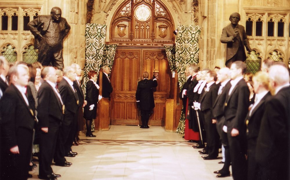 Black Rod knocks on the door of the House of Commons during the state opening of parliament; next year, this will be sarah clarke's job, the first woman to hold the appointment (UK Parliament)