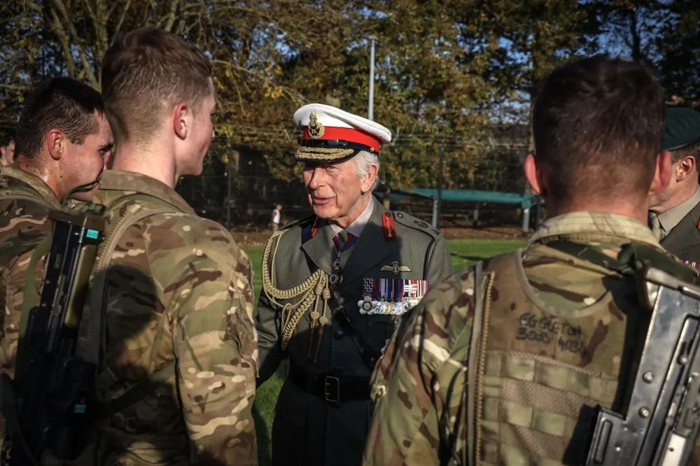 His Majesty greets Royal Marine Recruits during a training exercise. (Royal Navy)