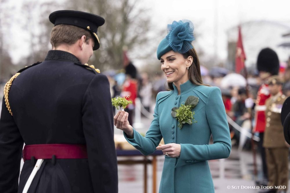 The Prince and Princess of Wales hand over duties at St Patrickís Day Kate hands over a sprig of shamrock to an officer