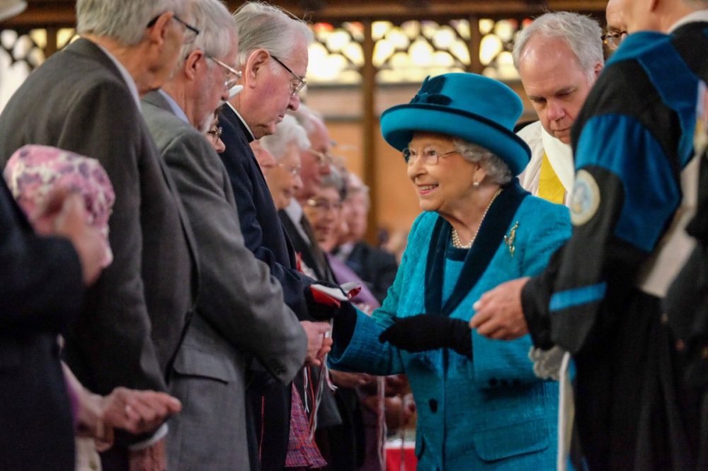 The Queen hands out red and white Maundy Money purses equalling her age this year, 91. (Royal Family)