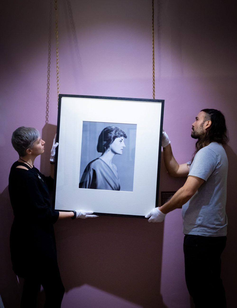 Conservators hang David Bailey photograph of Diana, Princess of Wales (c) Historic Royal Palaces