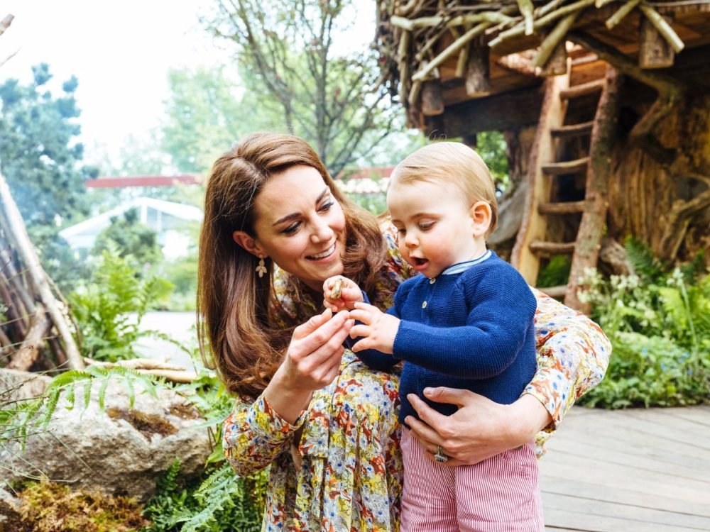 kate with prince louis in the garden