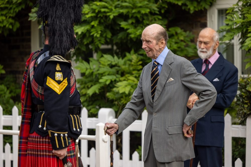 The Duke of Kent speaks to one of the Pipers from the Royal Scots Dragoon Guards at Kensington Palace. Prince Michael of Kent can be seen on the right. (Defence Imagery)
