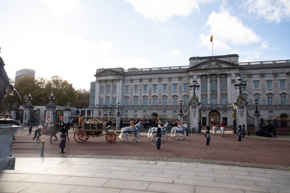 The State Carriages for the South African visit approach Buckingham Palace. (MOD)