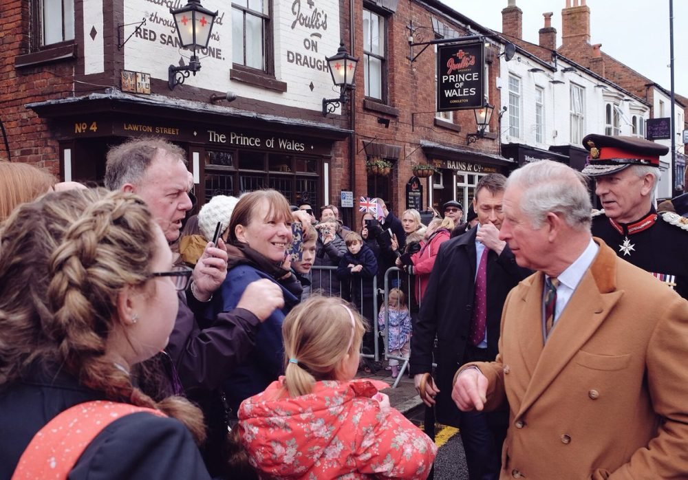 The Prince of Wales speaks to crowds gathered outside his namesake pub, where he popped in for a drink (Clarence House)