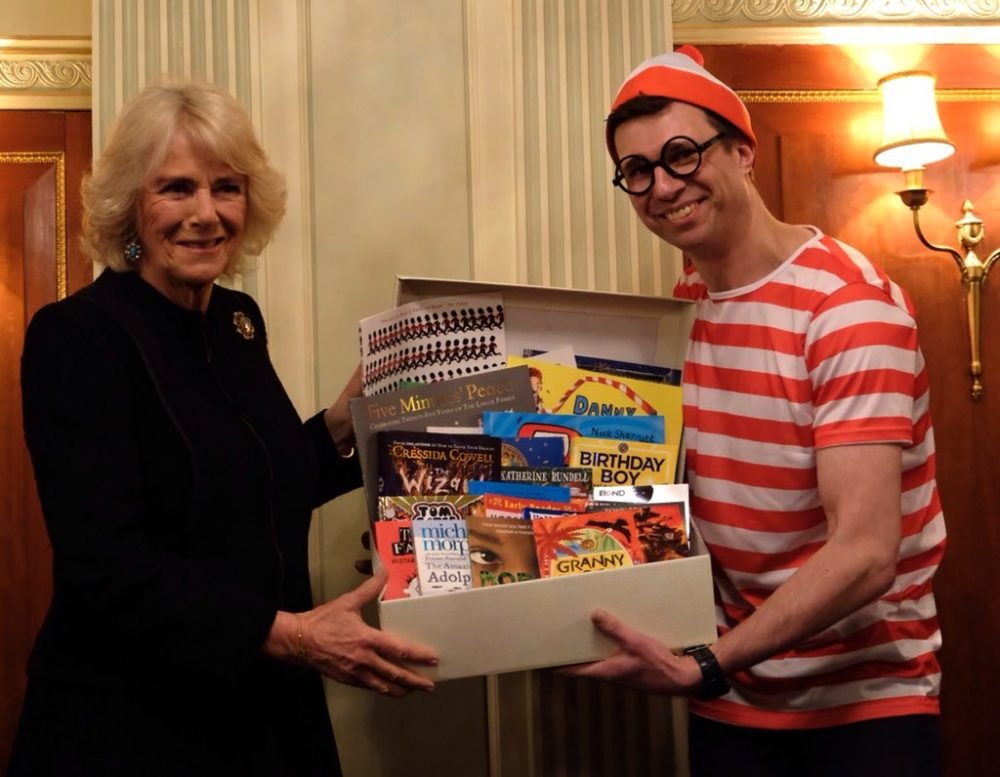 The Duchess of Cornwall is presented with 25 children's books to read to her grandchildren (Clarence House)