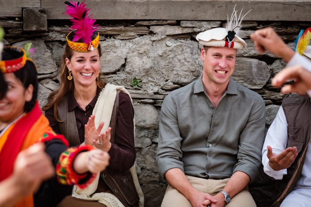 EHAIMIDX0AINA– Prince William and Kate are given traditional hats as they visit the northern area of Pakistan (Kensington Palace)