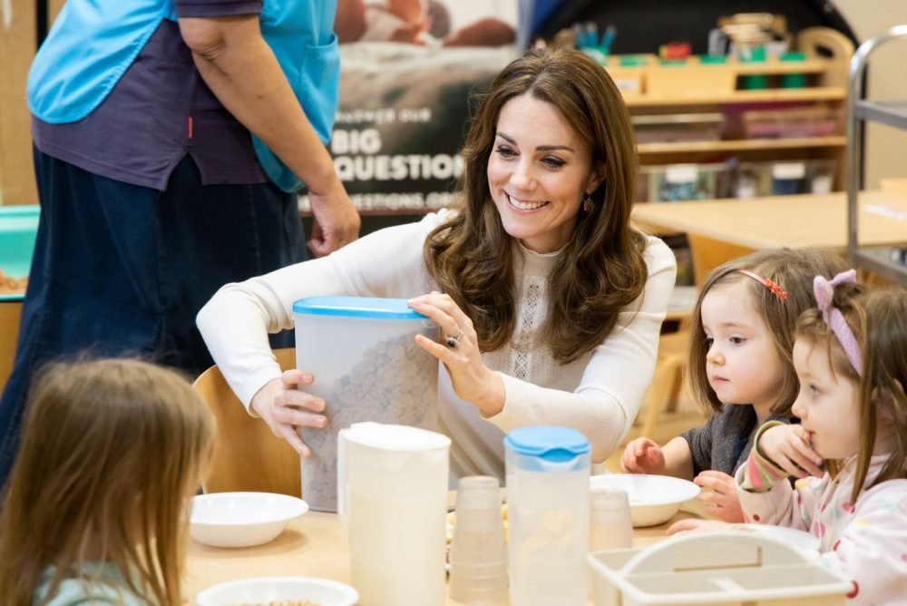 The Duchess of Cambridge visited an early nursery session today, serving breakfast; she was making up for her cancelled visit last week (Kensington Palace)