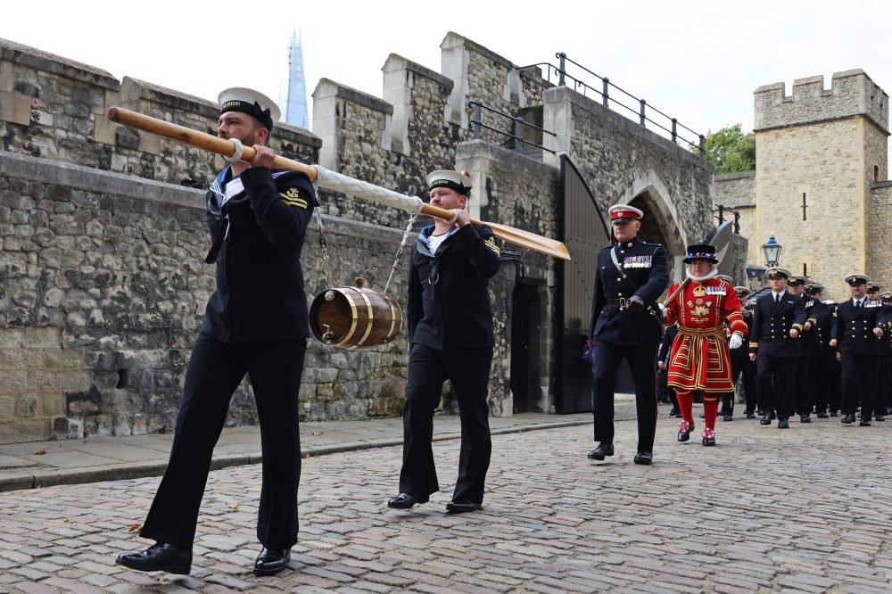 The ship's company of HMS Albion marches into the Tower of London with a barrel of rum to be presented to the Constable of the Tower during the Ceremony of the Dues. (Ministry of Defence)