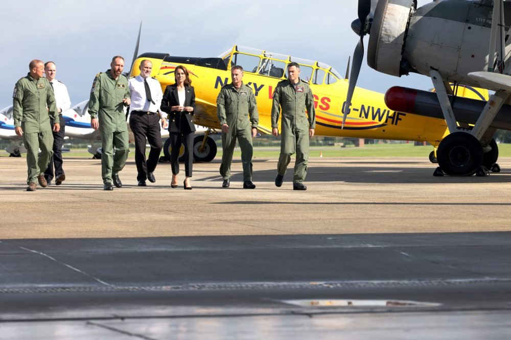 HRH THE PRINCESS OF WALES VISITS RNAS YEOVILTON Pictured: HRH The Princess of Wales walks to the hangar during the visit to RNAS Yeoviltion.
On the 18th of September 2023 Naval aviators welcomed their new patron for the first time as Her Royal Highness the Princess of Wales visited Royal Naval Air Station Yeovilton in Somerset.
In her role as the Commodore-in-Chief of the Fleet Air Arm, the Princess of Wales spent three hours at the air station  which is home to front-line Merlin and Wildcat helicopters supporting Royal Navy and Royal Marine operations worldwide.
Her Royal Highness introduction to naval aviation began with a roar as an F-35B Lightning buzzed Yeoviltons control tower; the stealth fighters are the most advanced aircraft in the UKs military arsenal and are currently operating aboard the nations flagship, HMS Queen Elizabeth, on her autumn deployment.