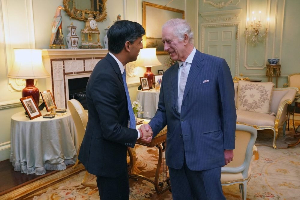 Charles greeting the Prime Minister at Buckingham Palace. (Royal Family).