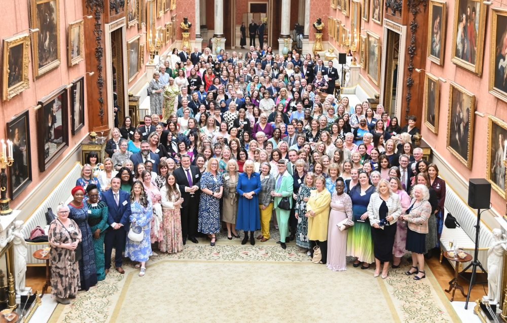 Camilla posing with guests at today's reception. (Royal Family).