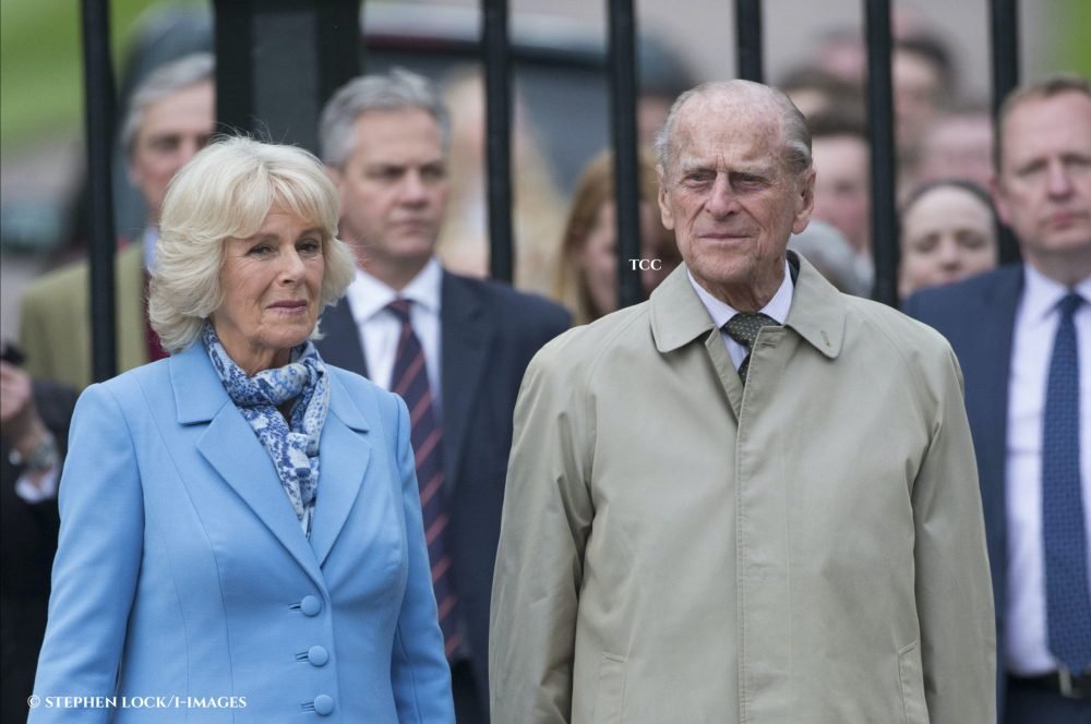 The Duchess of Cornwall and the Duke of Edinburgh watch The Queen lite a beacon outside Windsor Castle as she celebrates her 90th birthday