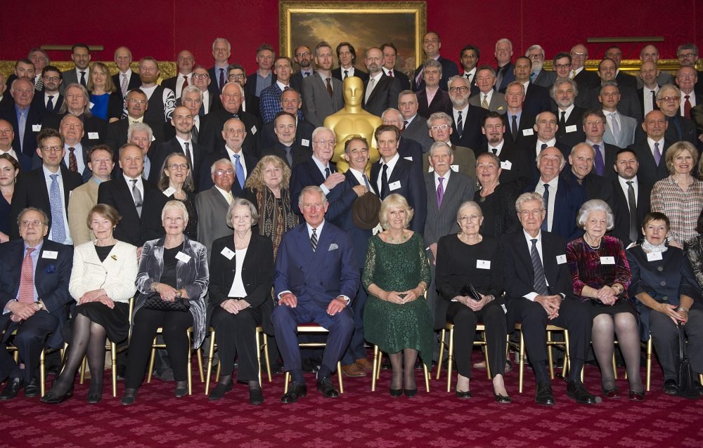Prince Charles and Camilla pose for a group photo at a reception in London for British Oscar winners . Picture by ROTA  / i-Images