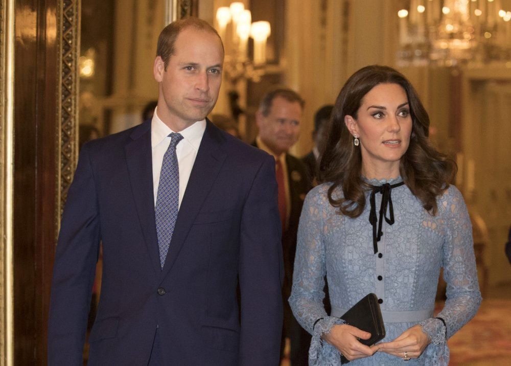 United Kingdom. The Duke and Duchess of Cambridge and Prince Harry at a World Mental Health Day reception at Buckingham Palace in London. It is the first time Kate has been seen in public since the announcement of her pregnancy. Picture by ROTA / i-Images  UK OUT FOR 28 DAYS
