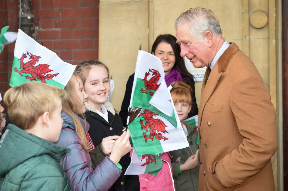 Prince Charles, The Prince of Wales, arrives at the Caerphilly Miners Community Centre in Wales. Picture by ROTA / i-Images