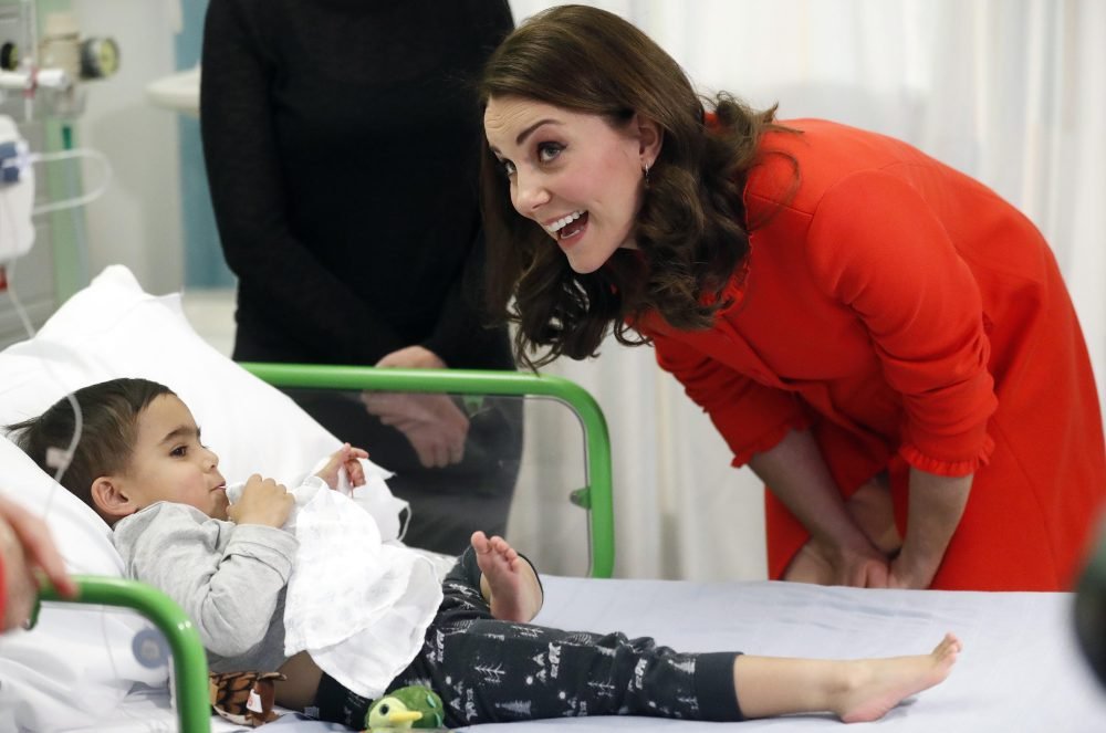 The Duchess of Cambridge talks to patient Rafael Chana, 4, as she visits Great Ormond Street Hospital about his love of olives. Picture by i-Images / Pool