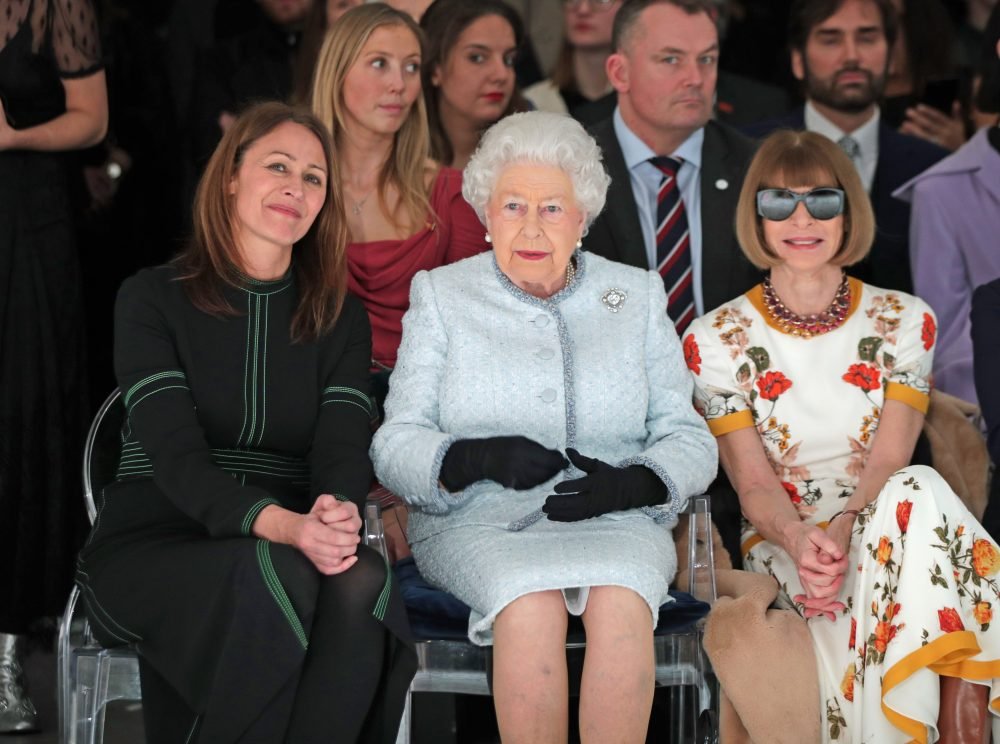 The Queen sits with Anna Wintour as they watch the  Richard Quinn show at London Fashion Week. Picture by ROTA / i-Images