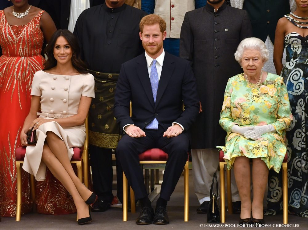 Image licensed to i-Images Picture Agency. 26/06/2018. London, United Kingdom. Queen Elizabeth II with the Duke and Duchess of Sussex at the Queen's Young Leaders Awards Ceremony at Buckingham Palace in  London. 
Picture by  i-Images / Pool