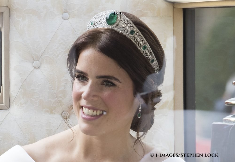 Image licensed to i-Images Picture Agency. 12/10/2018. Windsor, United Kingdom. Princess Eugenie waves to the crowds from her carriage after her wedding to Jack Brooksbank at Windsor Castle, United Kingdom.  Picture by Stephen Lock / i-Images