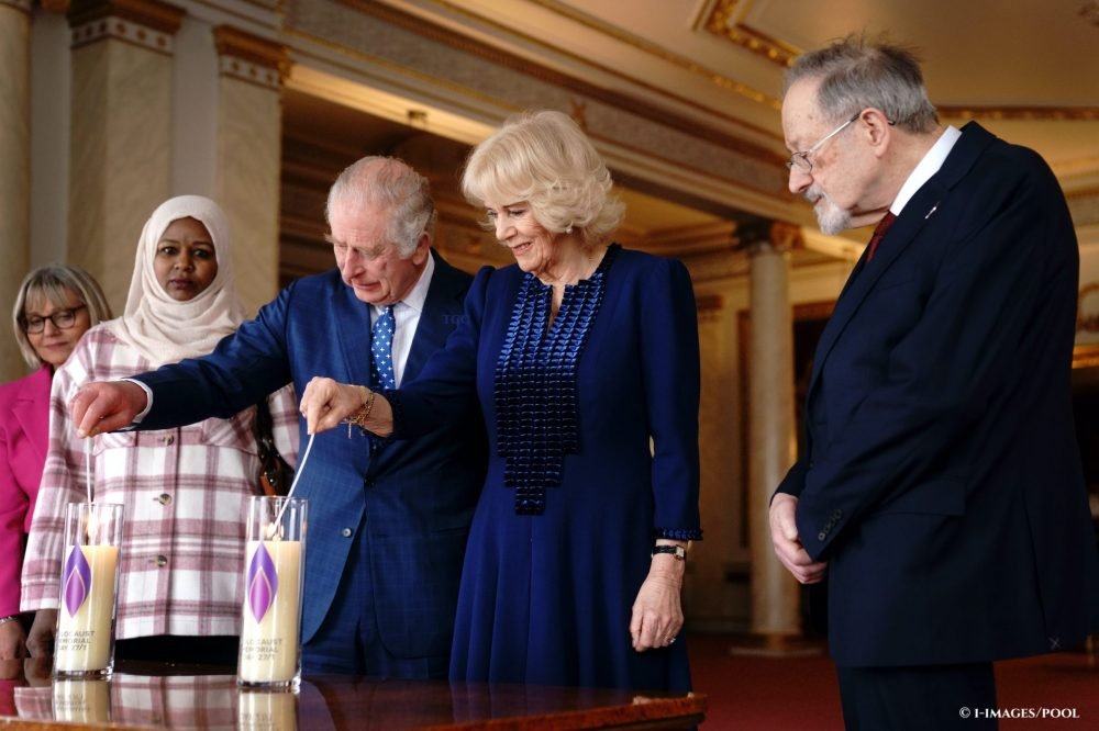 King Charles III and Camilla, The Queen Consort, with Holocaust survivor Dr Martin Stern, after lighting a candle to mark Holocaust Memorial Day at Buckingham Palace. (Royal Family)