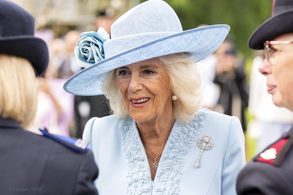 Queen Camilla at the Sovereign's Garden Party  at the Palace of Holyroodhouse in Edinburgh, on the first day of Royal Week in Scotland. She wore Queen Mary's thistle brooch