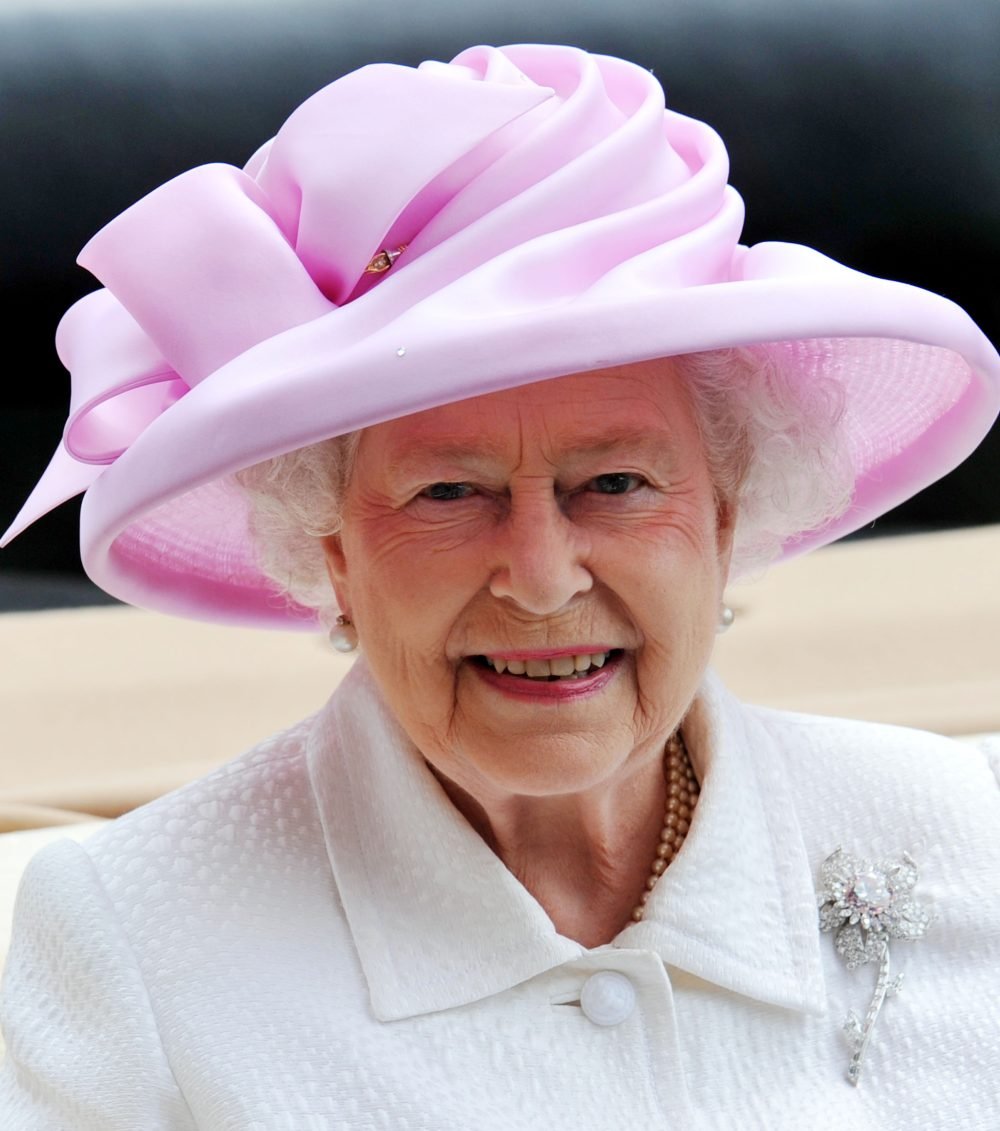 The Queen in her stunning pink diamond flower pin - the Williamson brooch. Photo by Andrew Parsons/ i-Images