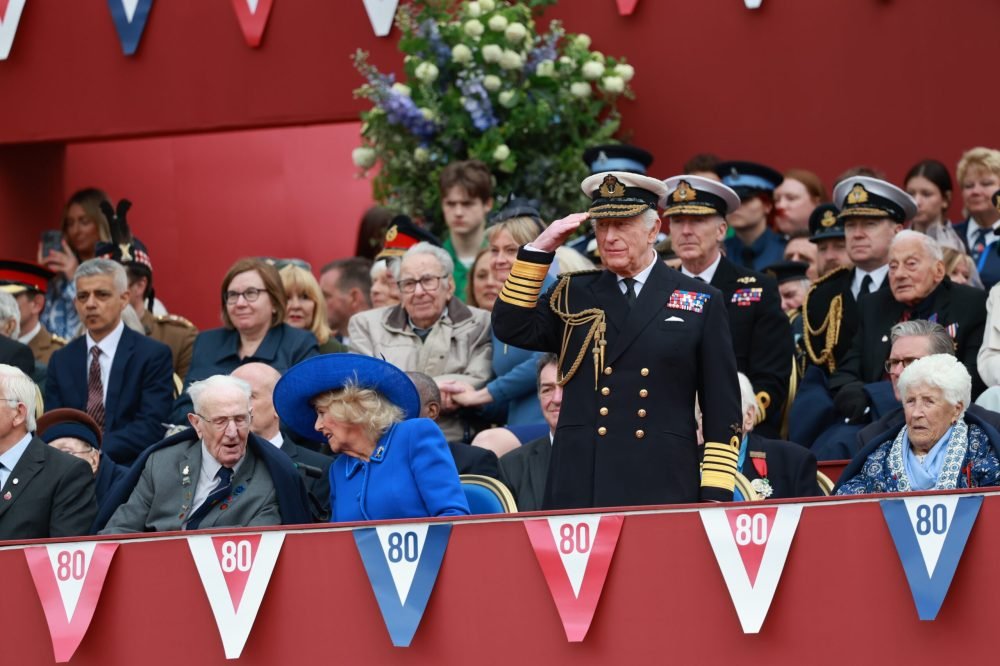 Pictured: The King salutes as the military procession approaches the Queen Victoria Memorial.

VIP's, members of The Royal family, and Cabinet Ministers in The Queen Victoria Memorial VIP box wait for the procession to approach.

A major military procession and flypast in central London has commenced the United Kingdom’s national commemorations of the 80th anniversary of the end of the Second World War in Europe – Victory in Europe Day.
 
The procession comprising of around 1,000 members of the Armed Forces from the Royal Navy, British Army and Royal Air Force and 23 aircraft will from the Royal Air Force flypast.

Ceremonies in Parliament Square will launch the procession as the Armed Forces march up Whitehall, through Admiralty Arch and down the Mall towards Buckingham Palace.

Second World War veterans will join special guests at the Queen Victoria Memorial to watch the procession.

Seven military bands are involved in the procession, including The Band of The Household Cavalry Mounted Regiment on horseback.

The Royal Air Force flypast will include a Second World War-era Lancaster from The Battle of Britain Memorial Flight and modern aircraft which have recently served on operations protecting the UK around the world.

The flypast will culminate in a spectacular display by The Royal Air Force Aerobatic Team – The Red Arrows – complete with their iconic red, white and blue smoke.
 
The UK Armed Forces will also take a leading role in VE Day 80 commemorations in Edinburgh, Belfast and Cardiff.