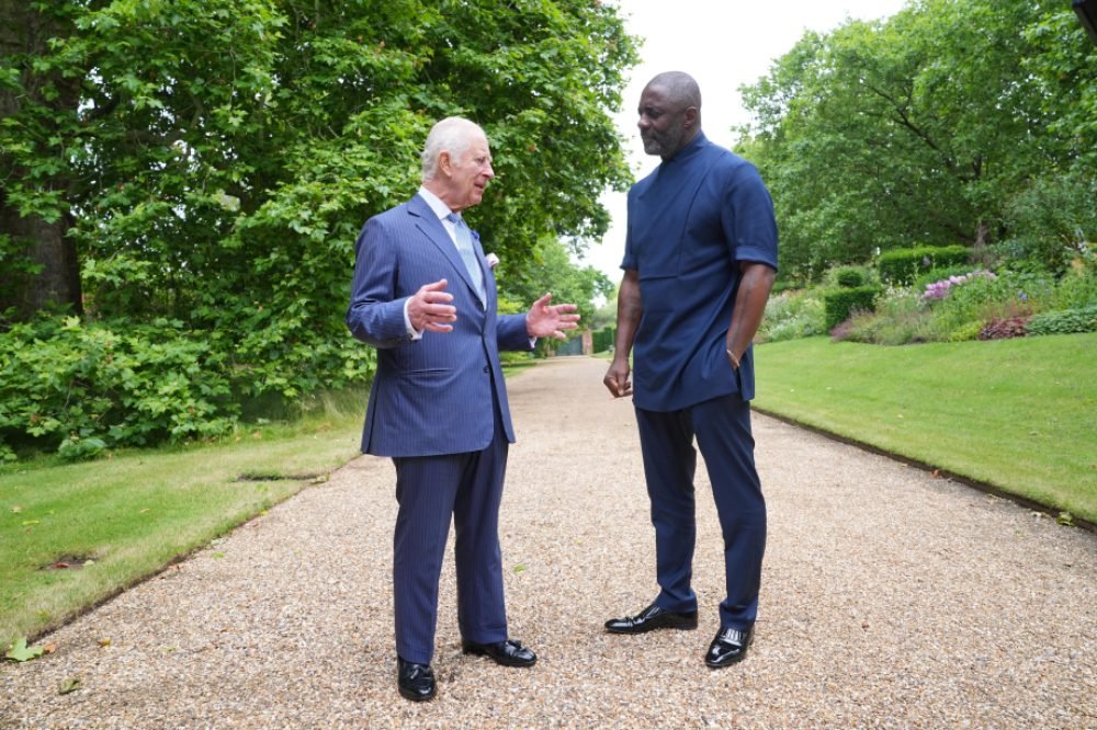 King Charles and Idris Elba talking in a garden. (Royal Family)
