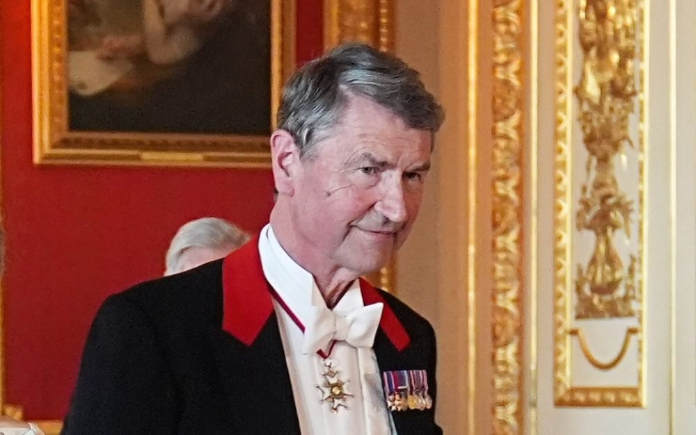 Sir Tim Laurence wearing the RVO on a neck ribbon