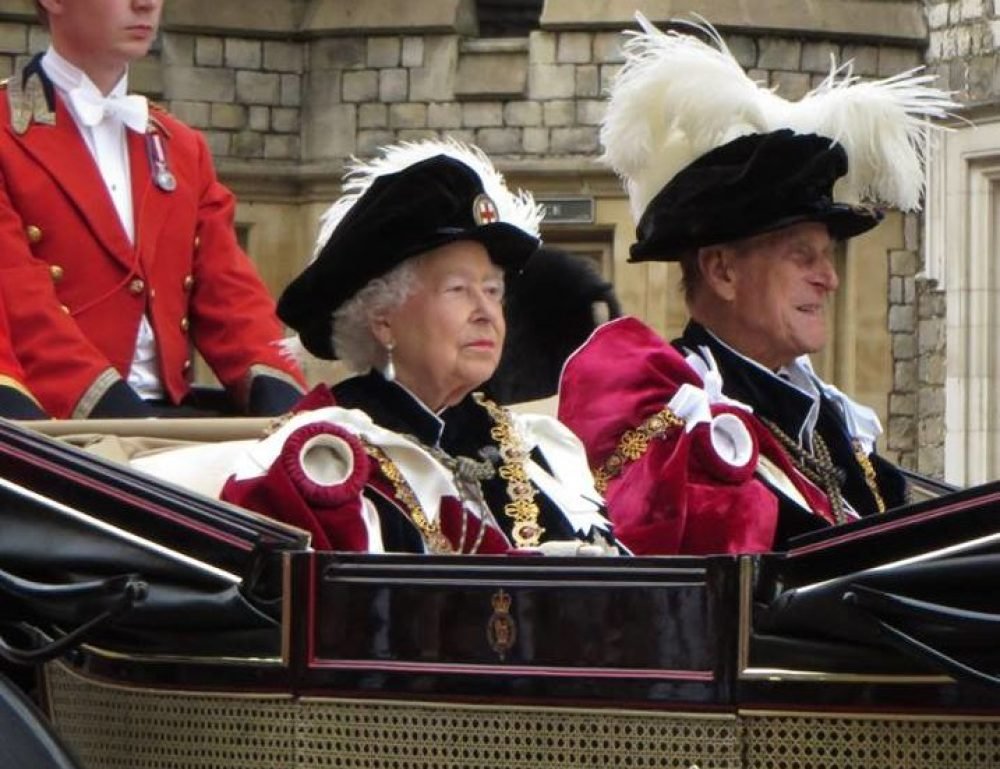 the queen and duke of edinburgh ride back to the private apartments of windsor in a carriage after the order of the garter service, june 2015 (victoria howard)